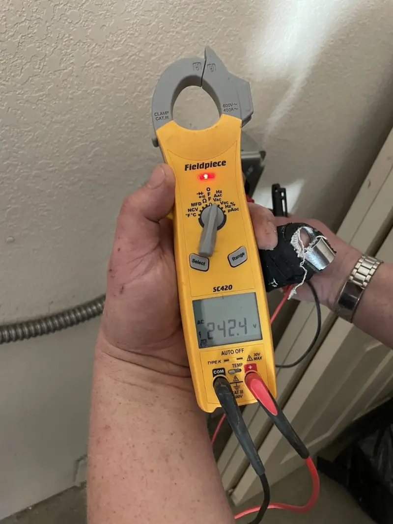 Voltage testing with clamp meter during Ceiling Fan Installation in Hokes Bluff